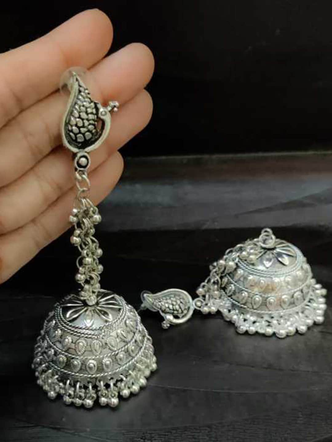 

Vembley Silver-Toned Peacock Shaped Jhumkas Earrings