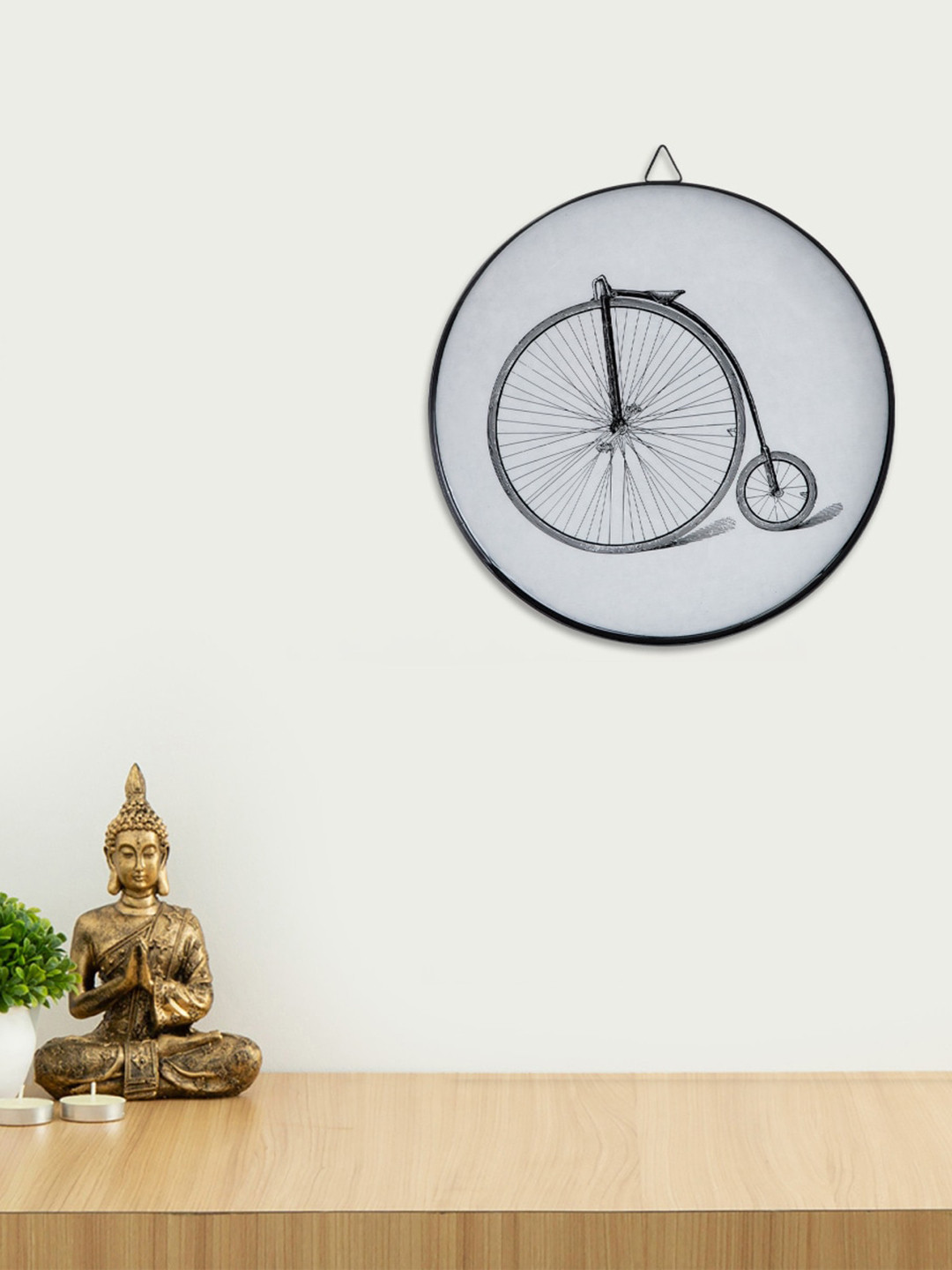 

Home Centre Off White & Black Cycle Printed Metal Wall Decor