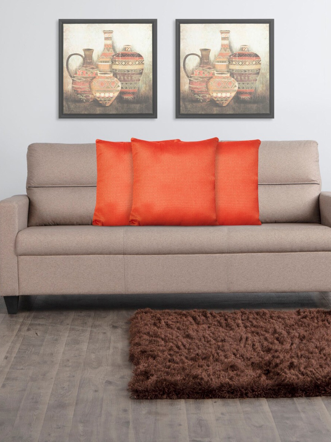 

Home Centre Orange Set of 3 Textured Filled Cushions