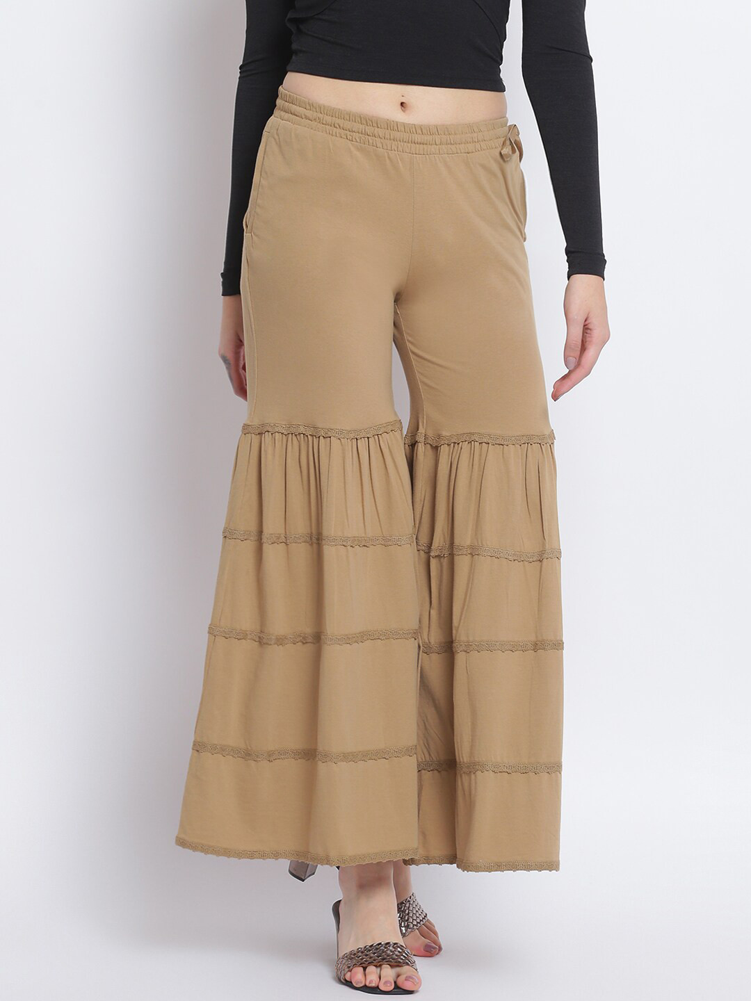 

Lakshita Women Beige Solid Flared Fit Cotton Palazzo