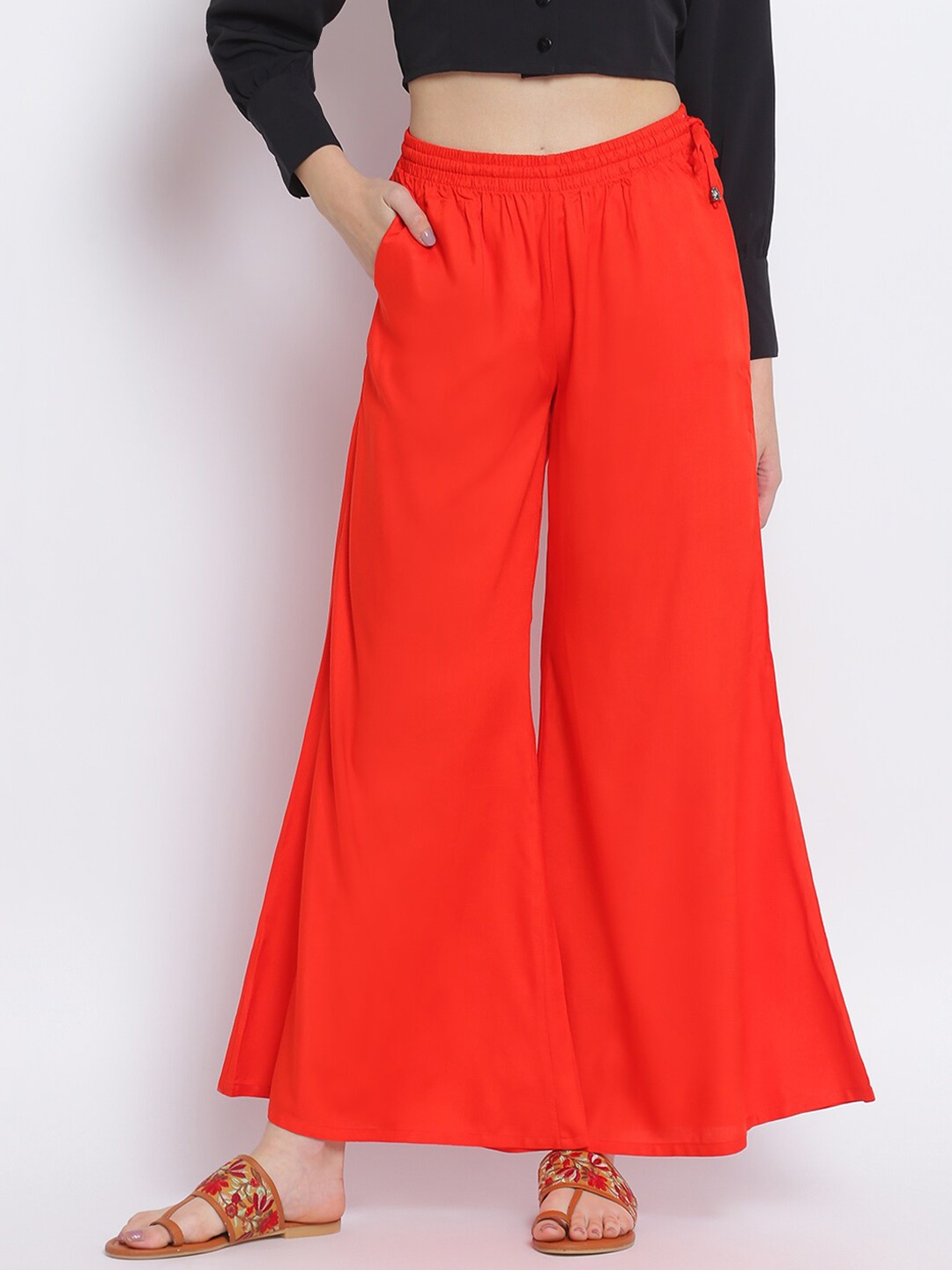 

Lakshita Women Orange Solid Flared Chambray Palazzos