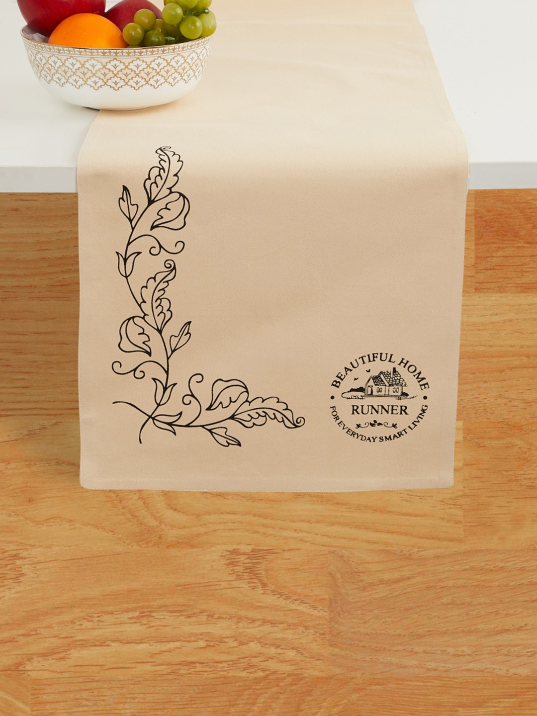 

Home Centre Beige & Black Printed Cotton Table Runner