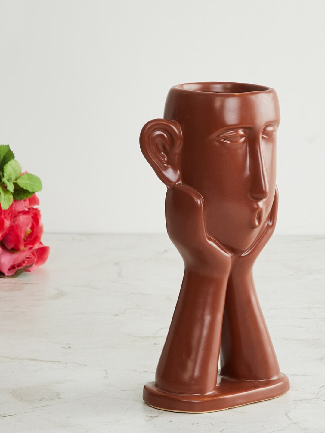 

Home Centre Brown Solid Face Shaped Ceramic Planter