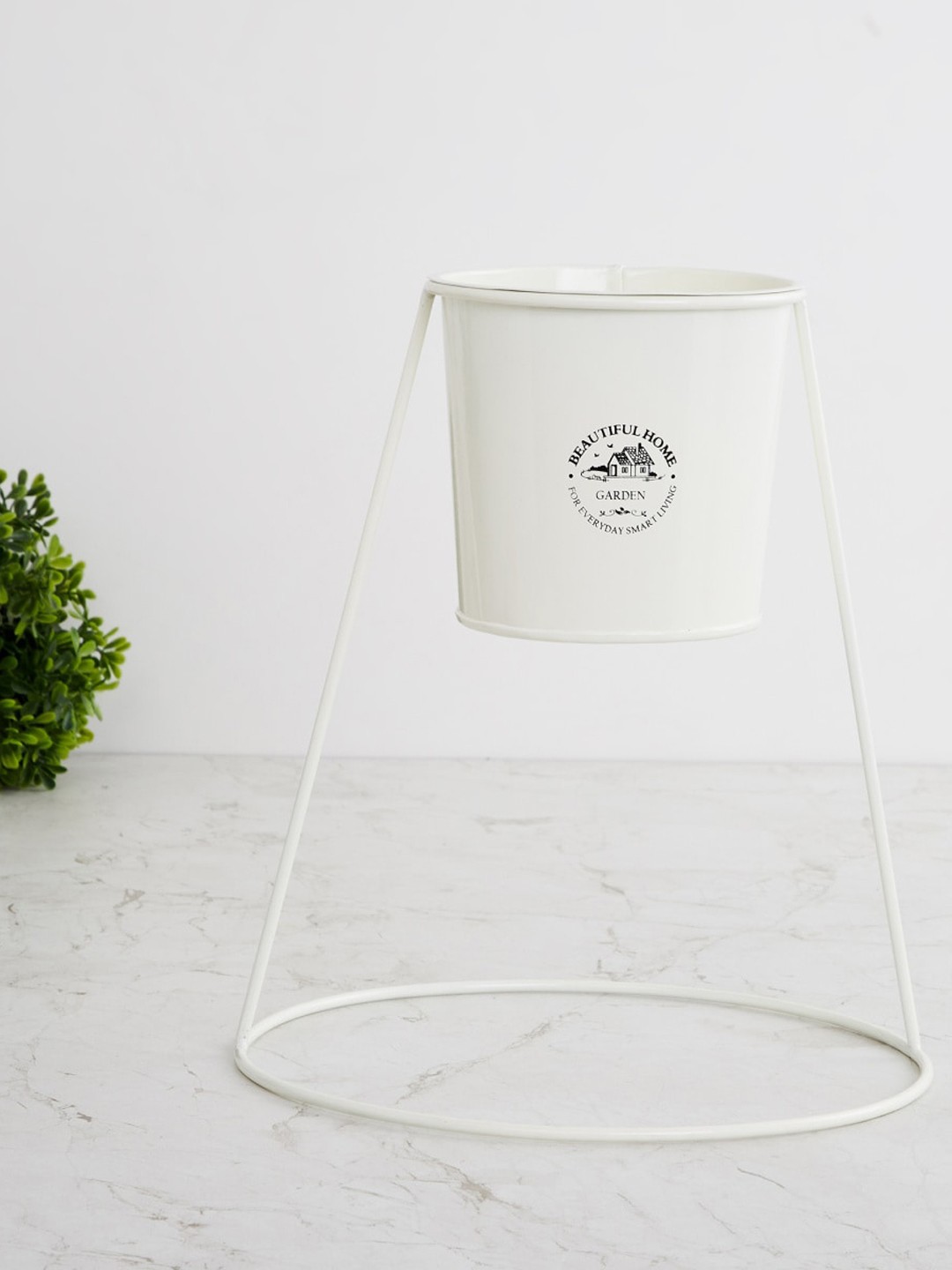 

Home Centre Off-White & Black Printed Metal Floor Planter With Stand