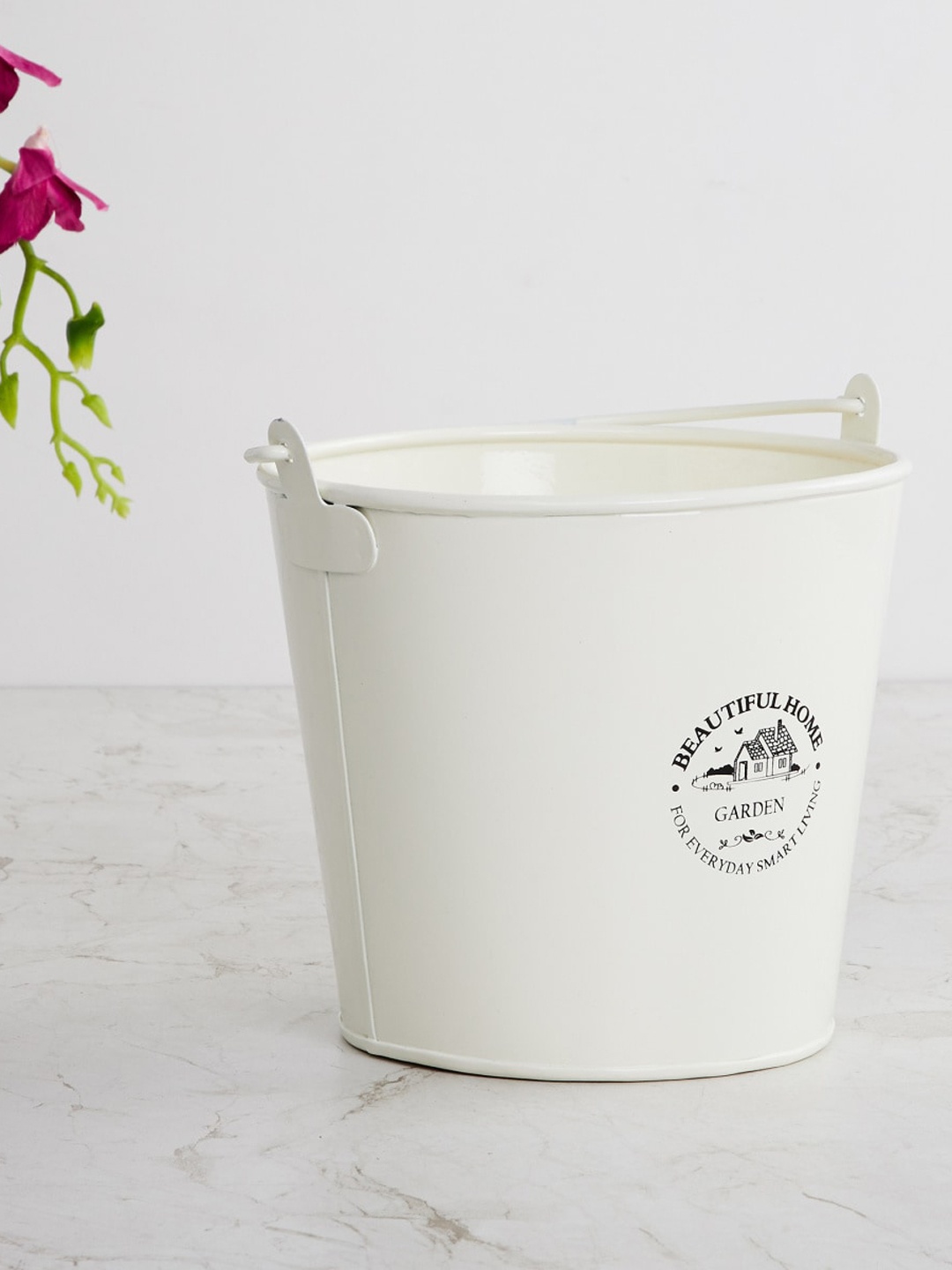 

Home Centre Off White Printed Metal Bucket Shaped Planter