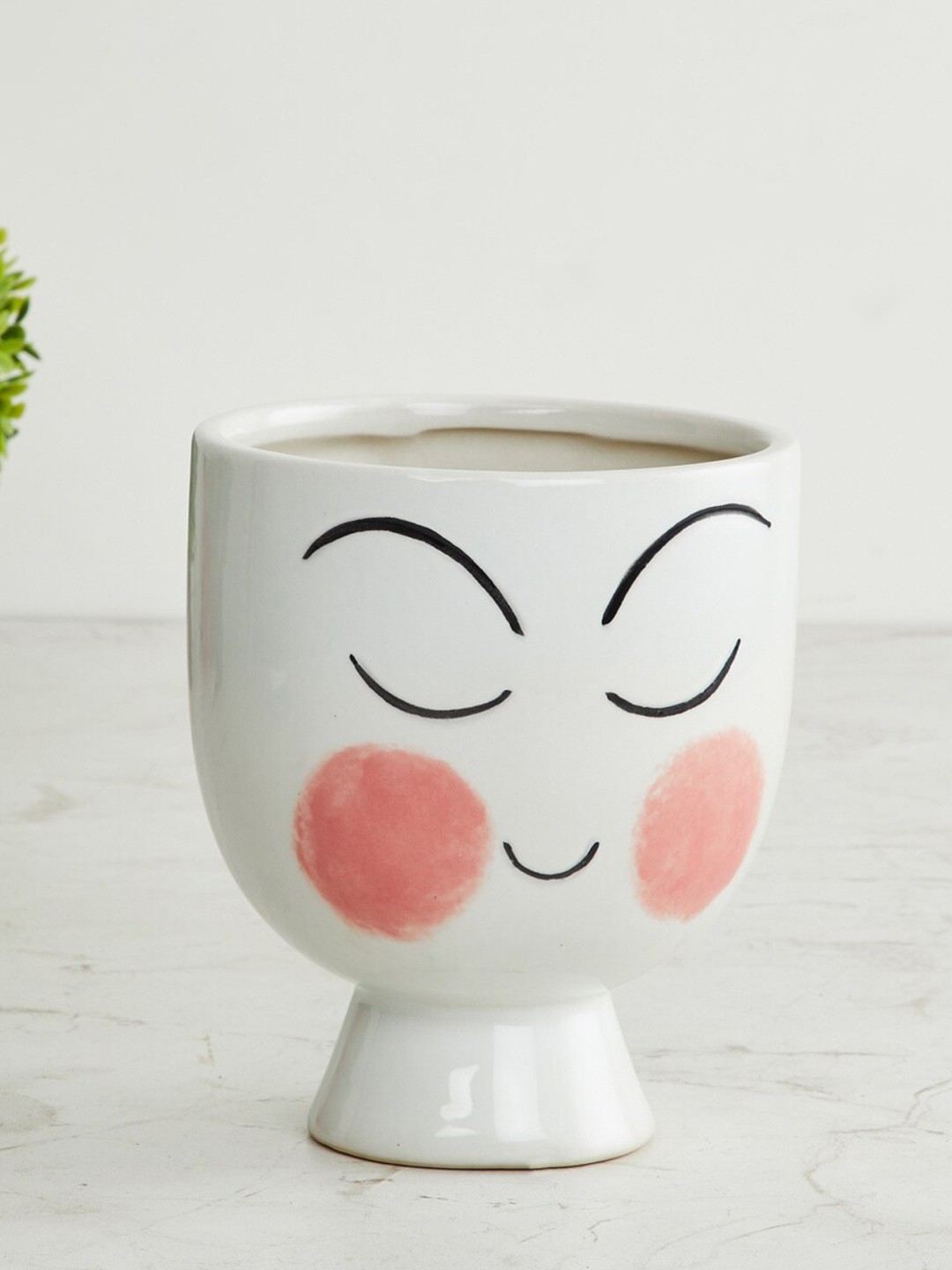 

Home Centre White Printed Shaped Ceramic Planter