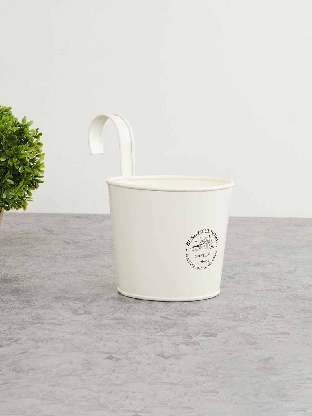 

Home Centre Off-White & Black Printed Metal Rail Planter