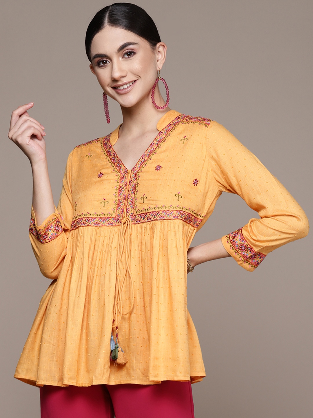 

aarke Ritu Kumar Yellow Embroidered Mandarin Collar Cinched Waist Top