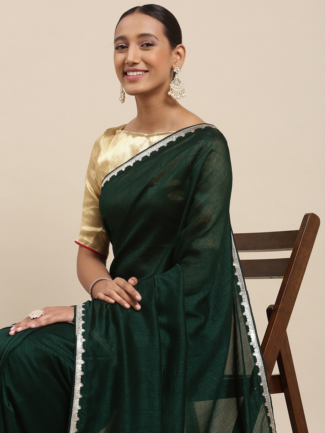 

Mitera Women Green & Silver Floral Embroidered Silk Blend Saree