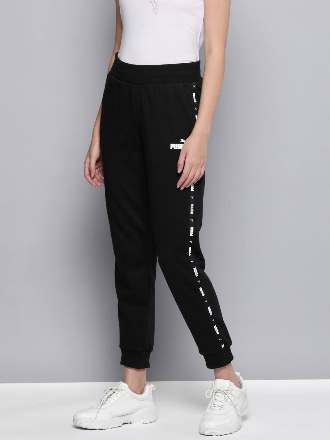 

Puma Women Black Brand Logo Side Taped Regular Fit Sustainable Joggers