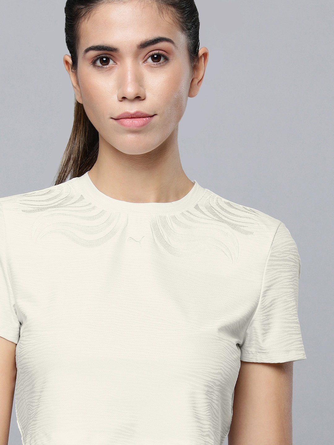 

Puma Women White Self Designed Slim Fit Crop Sustainable T-shirt