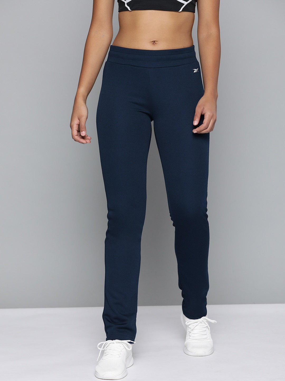 

Reebok Women Navy Blue Training Essentials Vector Solid Track Pants