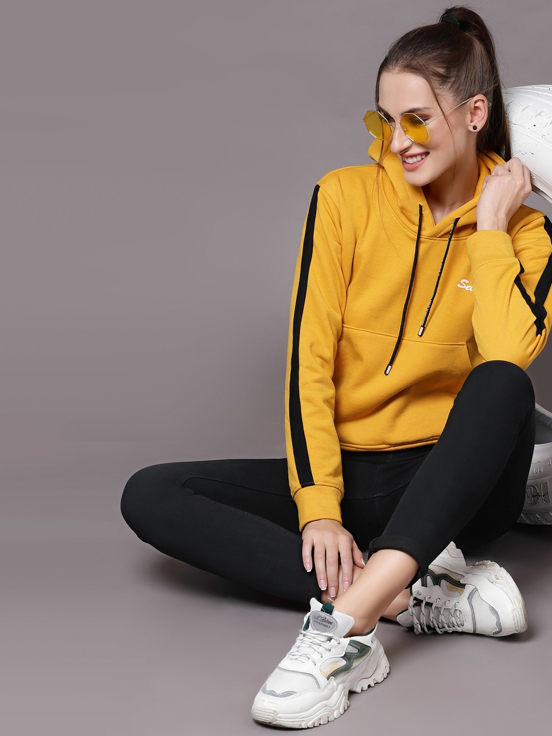 

Selvia Women Mustard Yellow & White Brand Logo Printed Hooded Sweatshirt