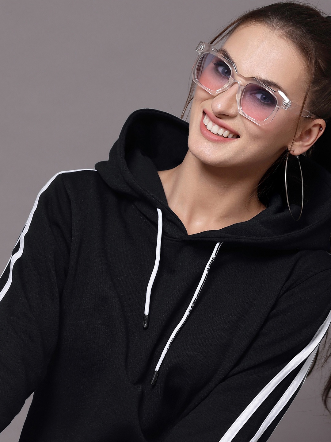 

Selvia Women Black & White Solid Hooded Sweatshirt
