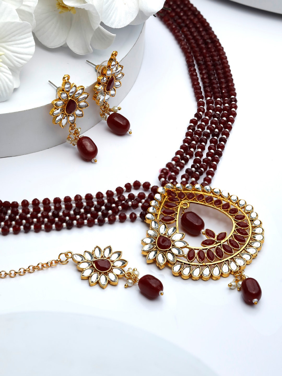 

Priyaasi Gold-Plated & Maroon Kundan Stone Studded Jewellery Set