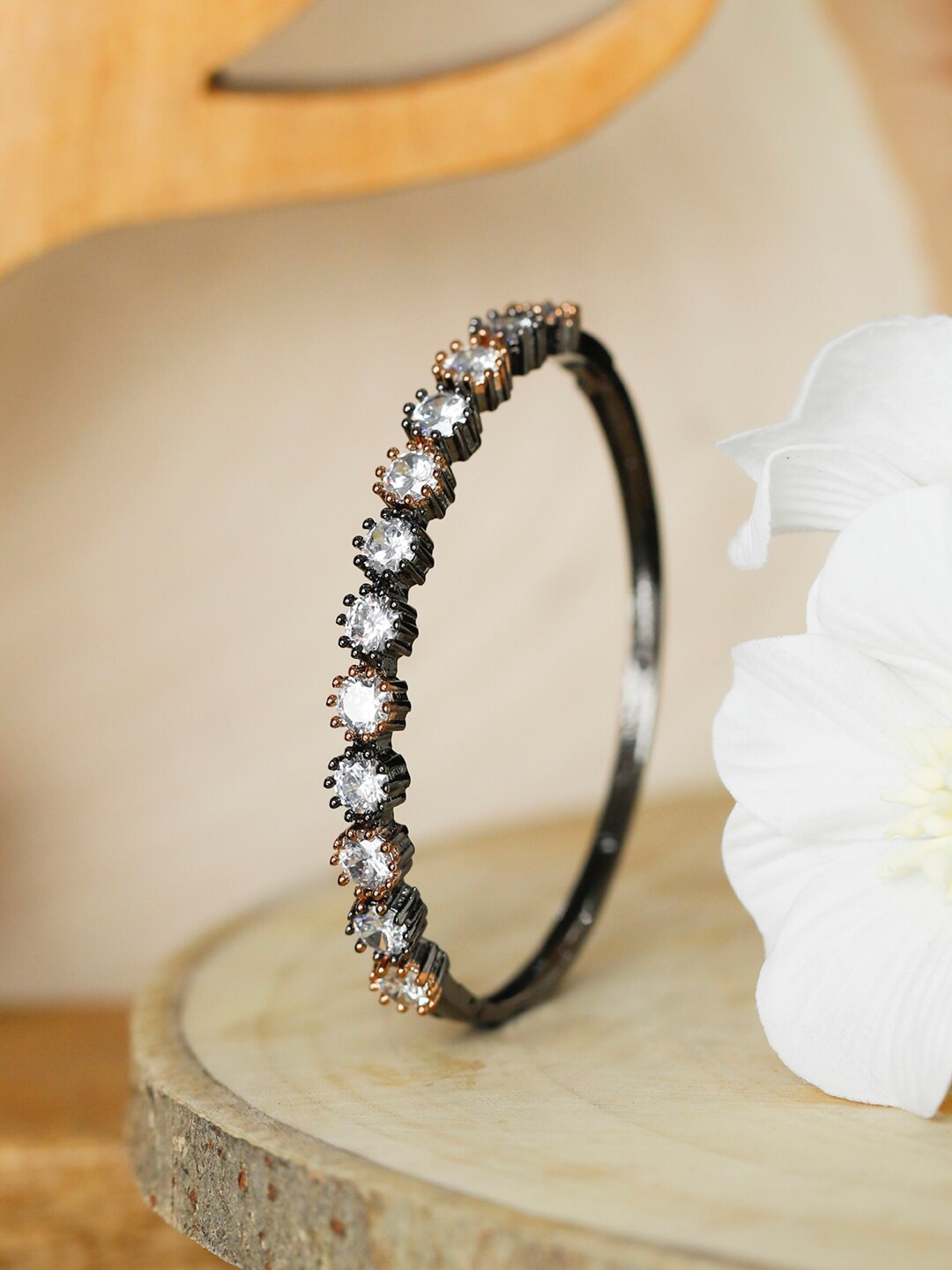 

Priyaasi Women Silver-Toned & Rose Gold Toned Brass American Diamond Bangle-Style Bracelet