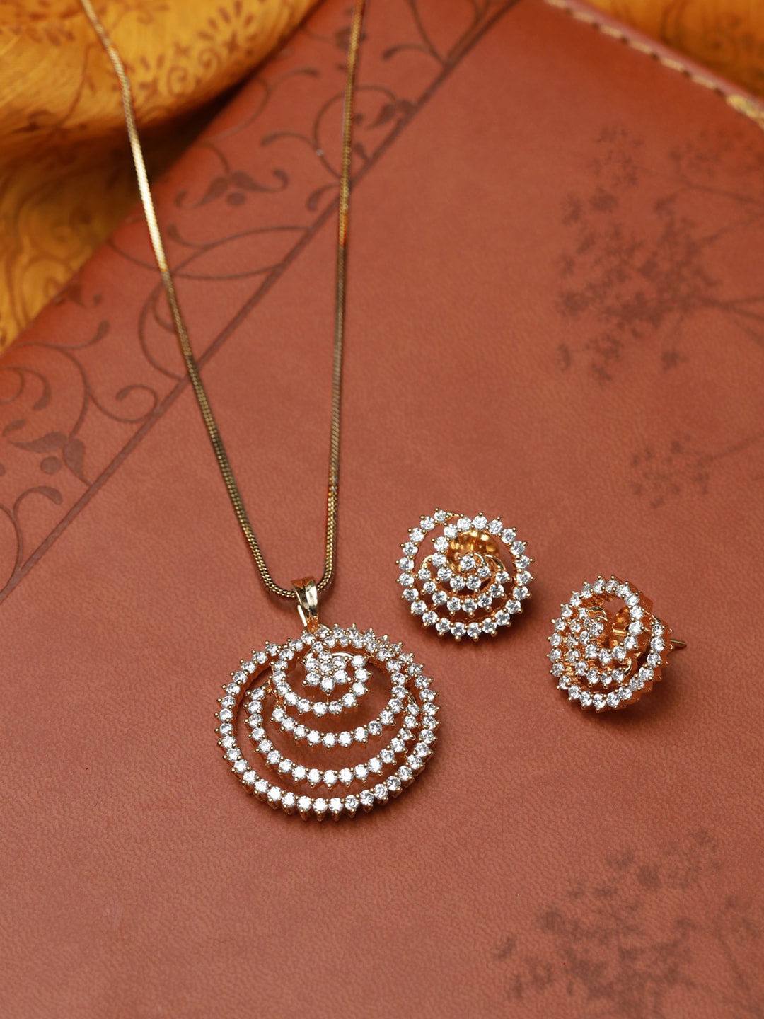 

Priyaai Gold Plated American Diamond Spiral Pendant & Earring Set