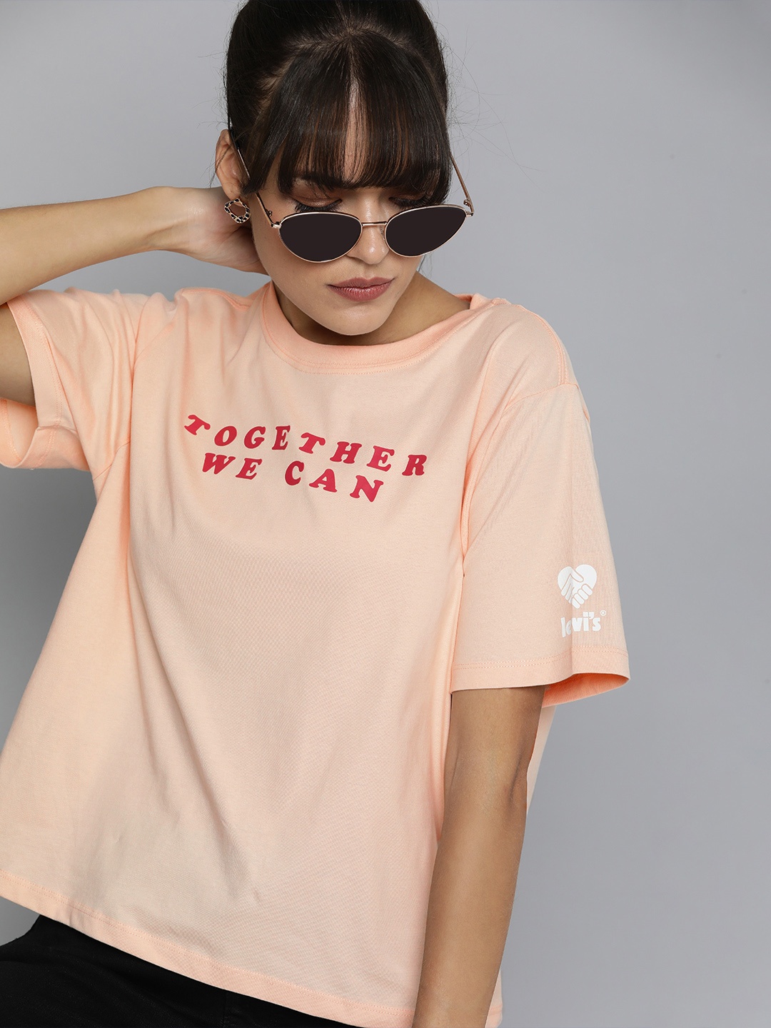 

Levis Women Peach-Coloured & Cream-Coloured Typography Printed Pure Cotton T-shirt