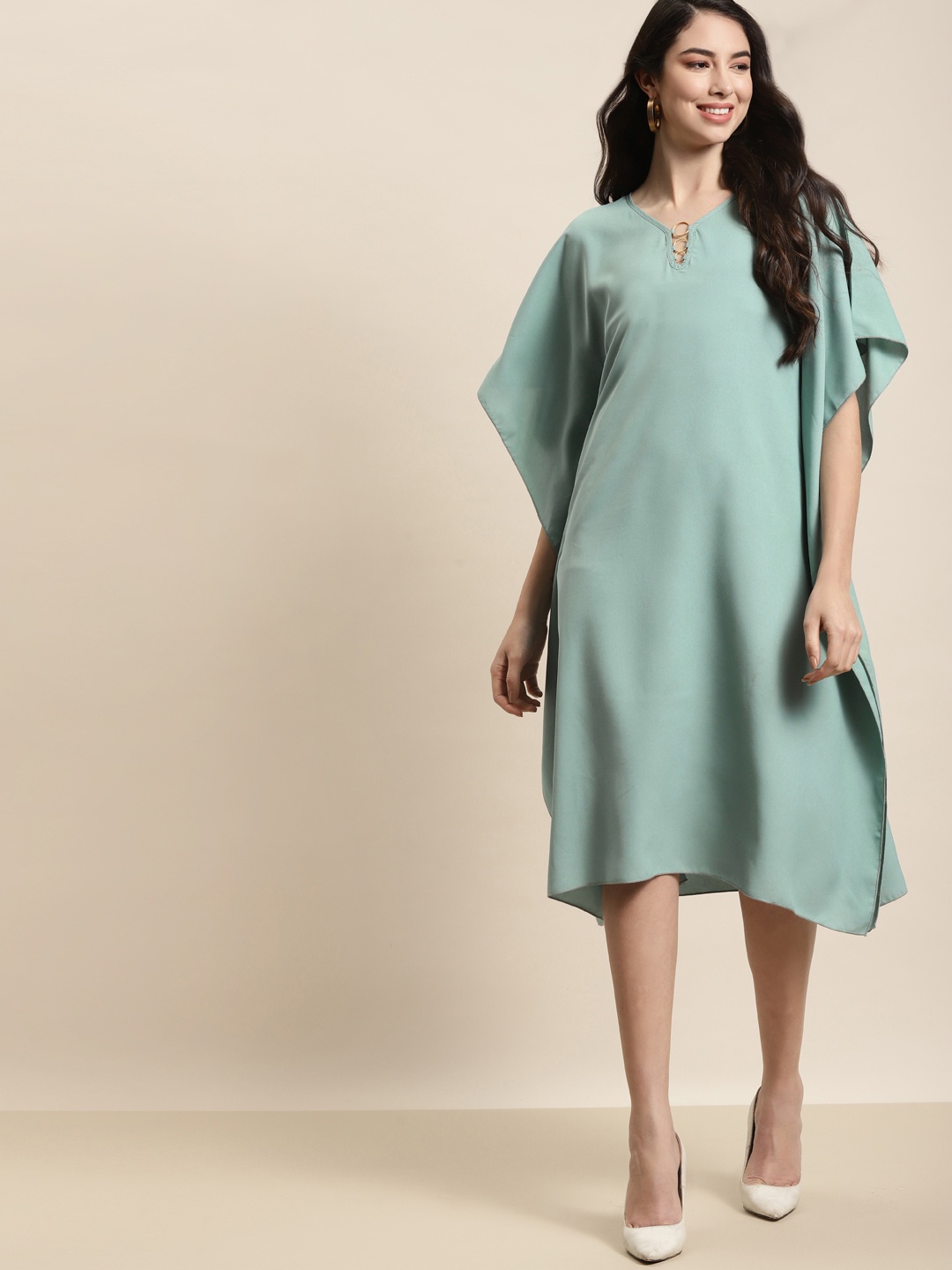 

Qurvii Sea Green Crepe Kaftan Dress With Gold Metal Rings