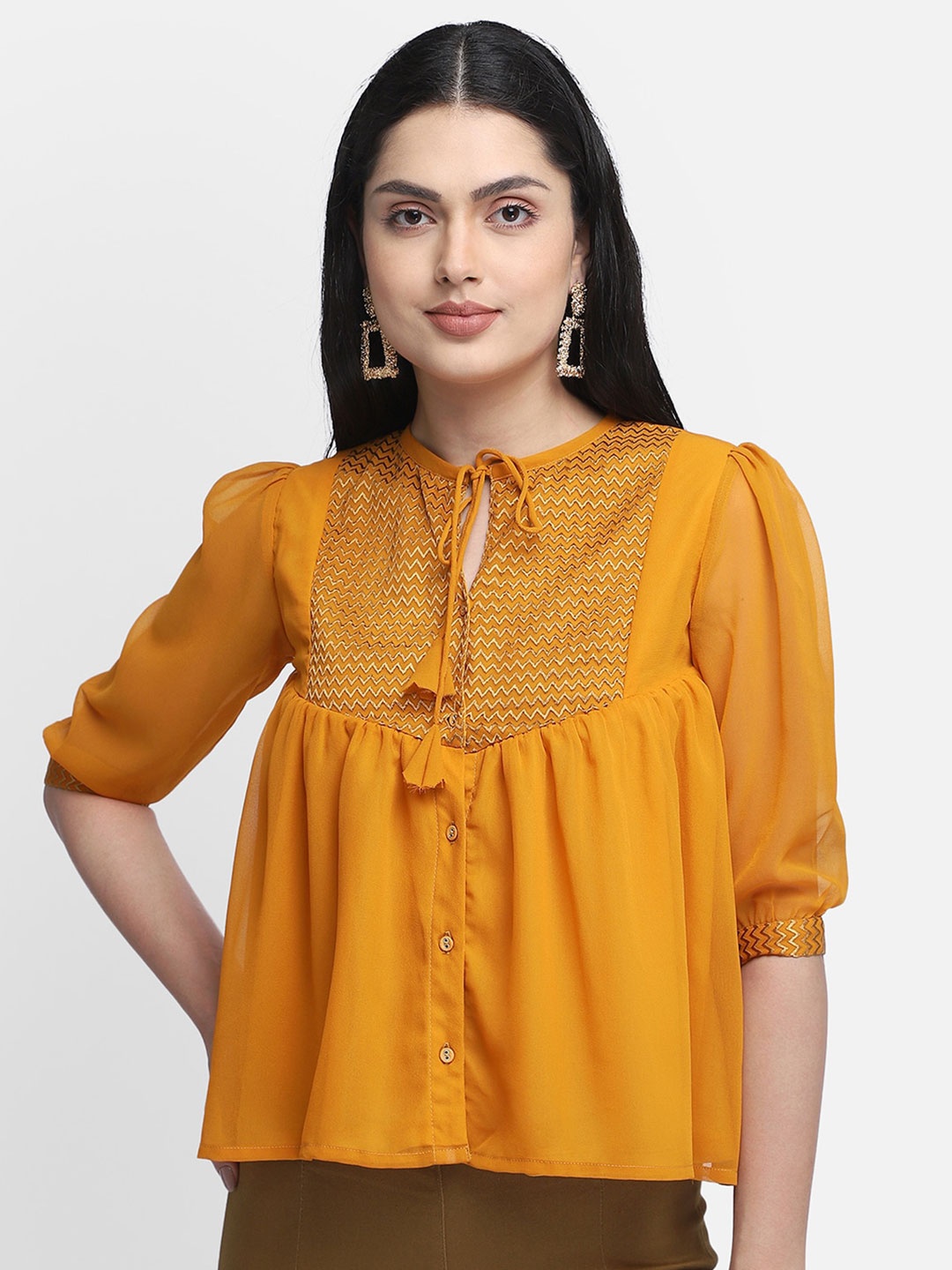 

Yaadleen Mustard Yellow Tie-Up Neck Georgette Top