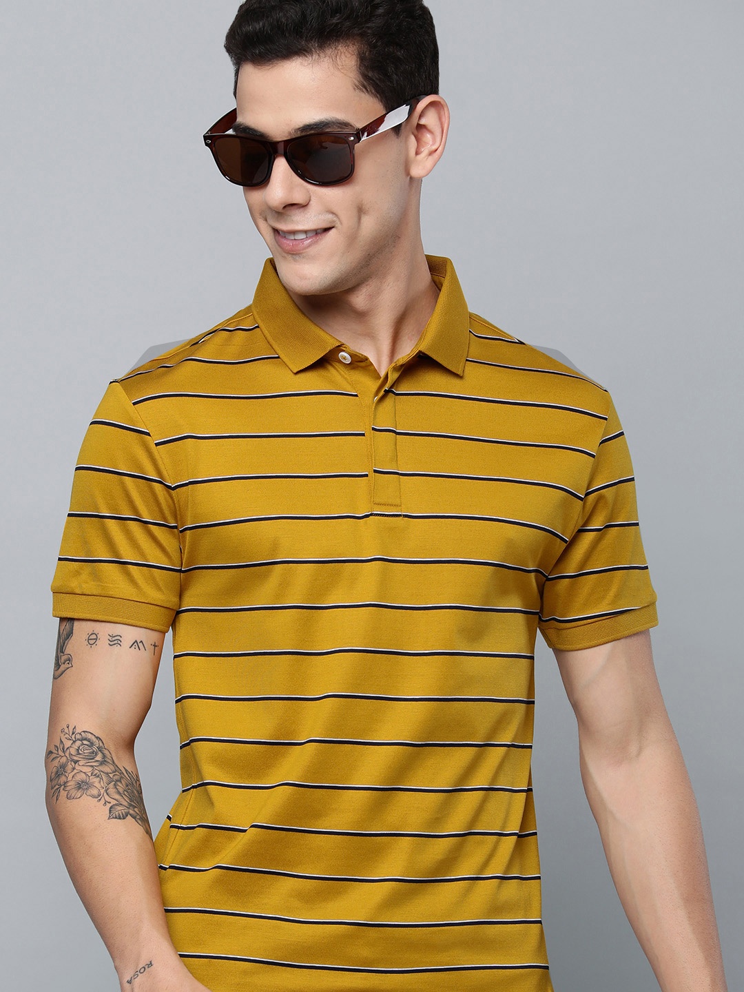 

Levis Men Mustard Yellow & Black Striped Polo Collar Pure Cotton T-shirt
