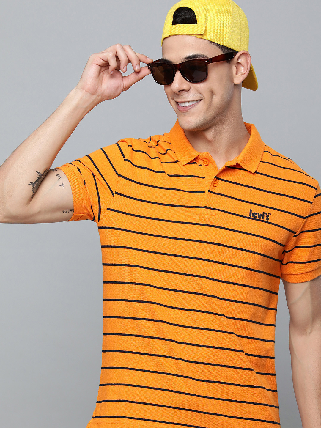 

Levis Men Yellow & Black Striped Polo Collar Pure Cotton T-shirt