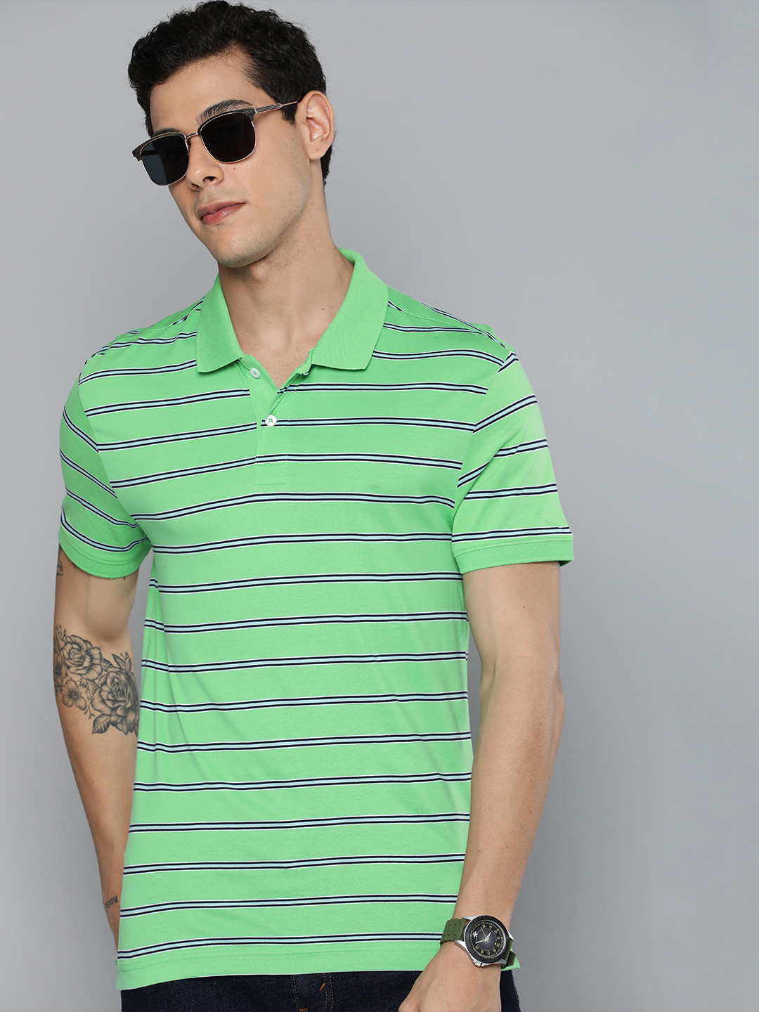

Levis Men Green & Black Striped Polo Collar Pure Cotton Casual T-shirt