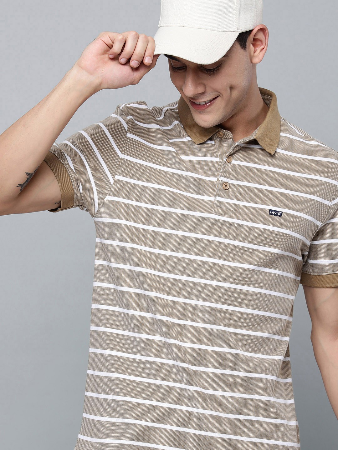 

Levis Men Brown & White Striped Polo Collar Pure Cotton T-shirt