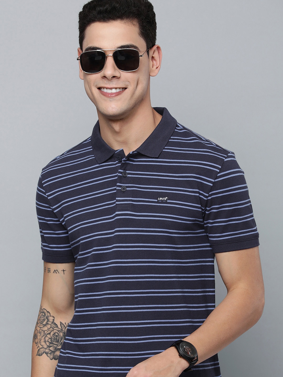 

Levis Men Navy Blue & Blue Striped Polo Collar Pure Cotton T-shirt