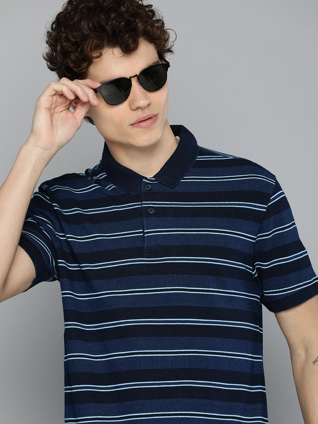

Levis Men Navy Blue & White Striped Polo Collar Pure Cotton T-shirt
