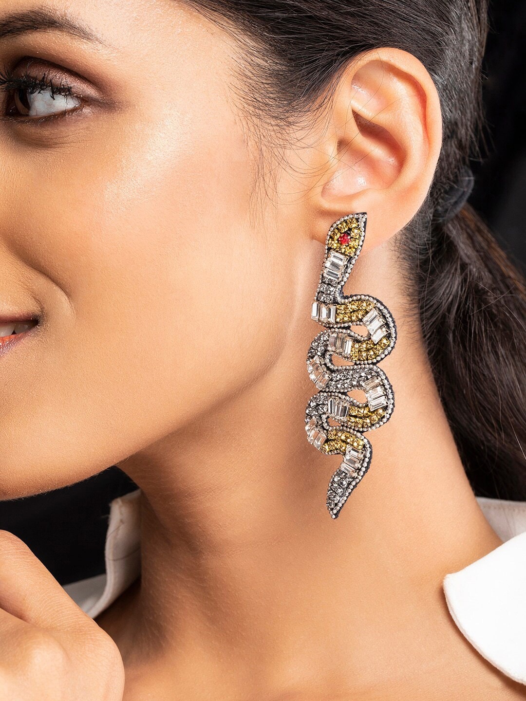 

Rubans Voguish Metallic Stone Studded Snake Shape Drop Earrings