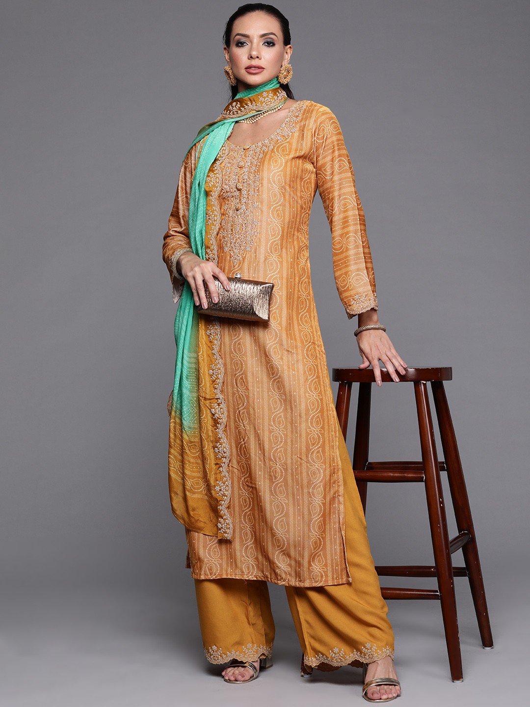 

Indo Era Women Mustard Yellow Embroidered Velvet Bandhani Kurta & Palazzo With Dupatta