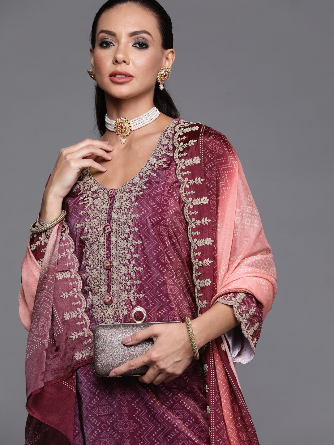 

Indo Era Women Purple & Pink Embroidered Velvet Bandhani Kurta & Palazzo With Dupatta