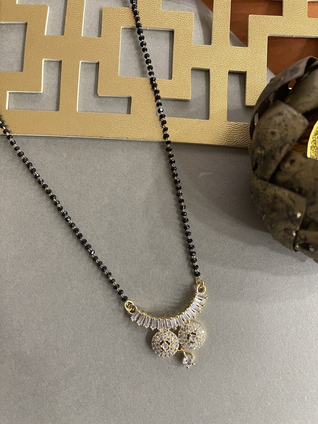 

Digital Dress Room White & Black Gold-Plated Beaded Mangalsutra