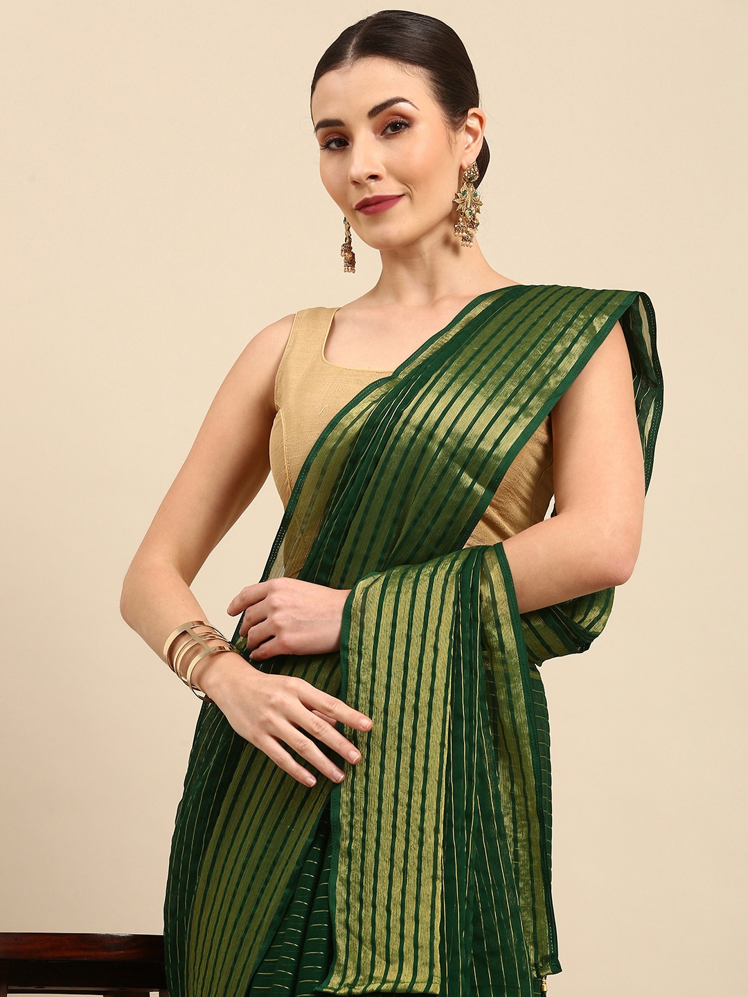 

Anouk Green & Golden Striped Pure Chiffon Bhagalpuri Saree