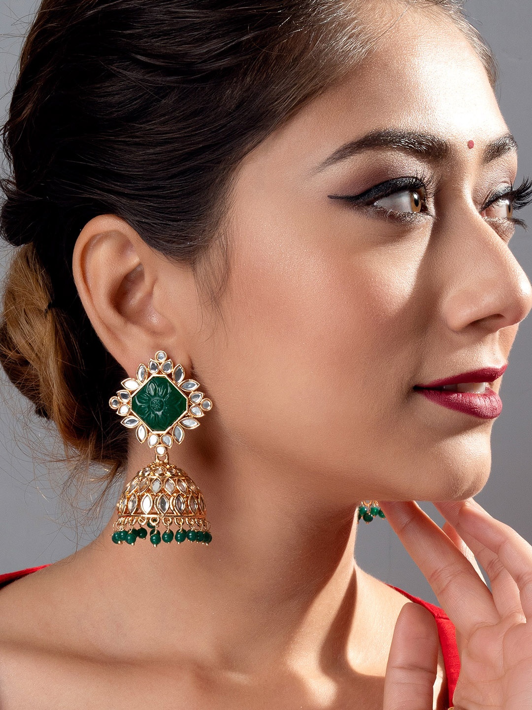 

aadita Gold-Plated Green Pearls Jhumkas Earrings
