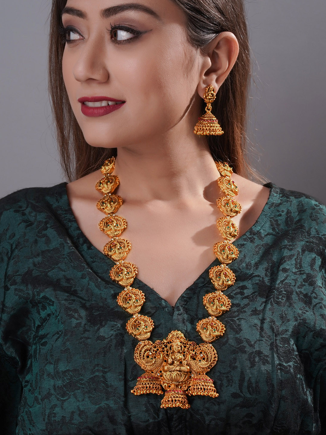 

aadita Gold-Plated Red & Green Stone-Studded Temple Jewellery Set