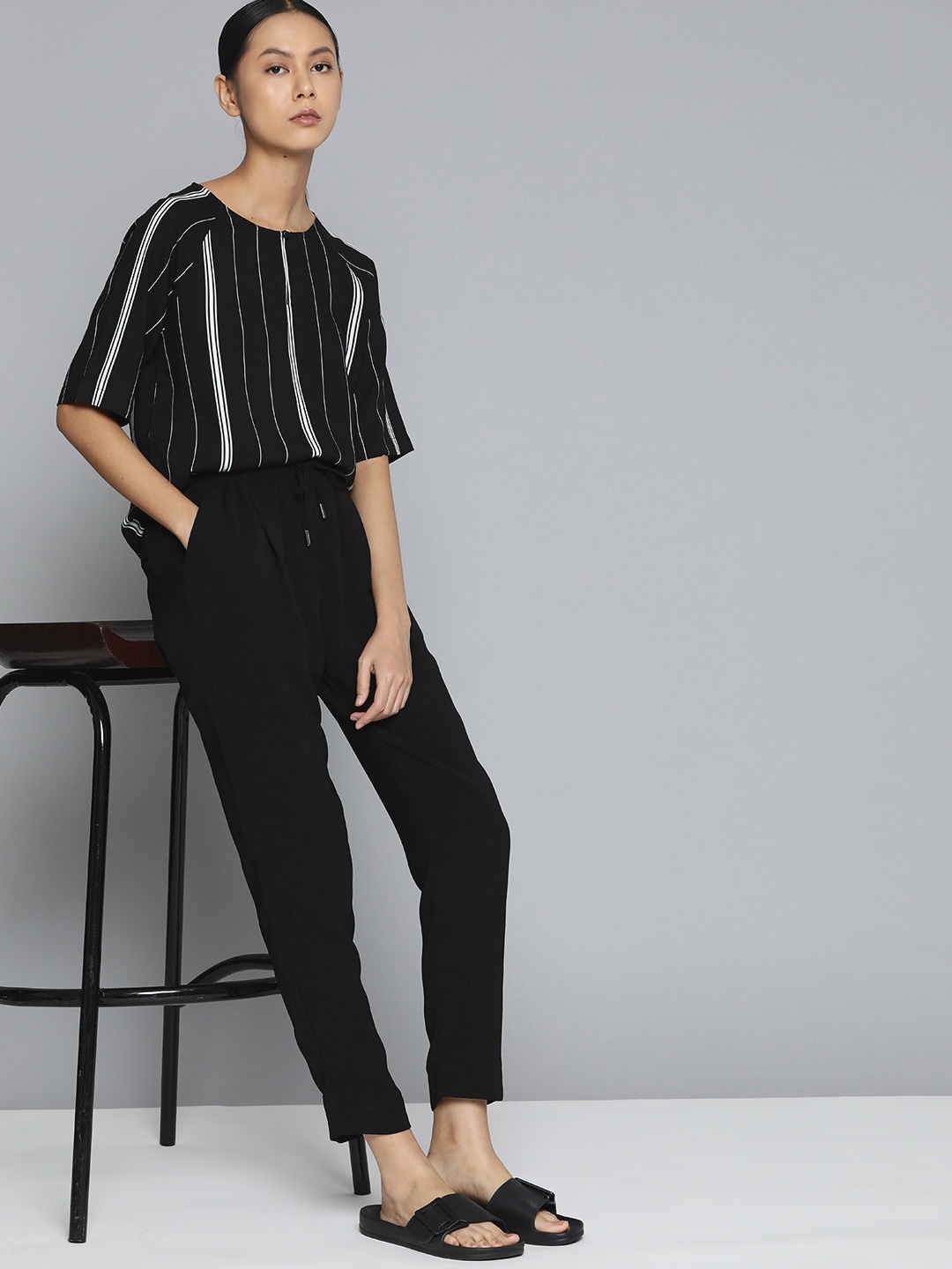 

ether Women Black Solid Regular Fit Trousers