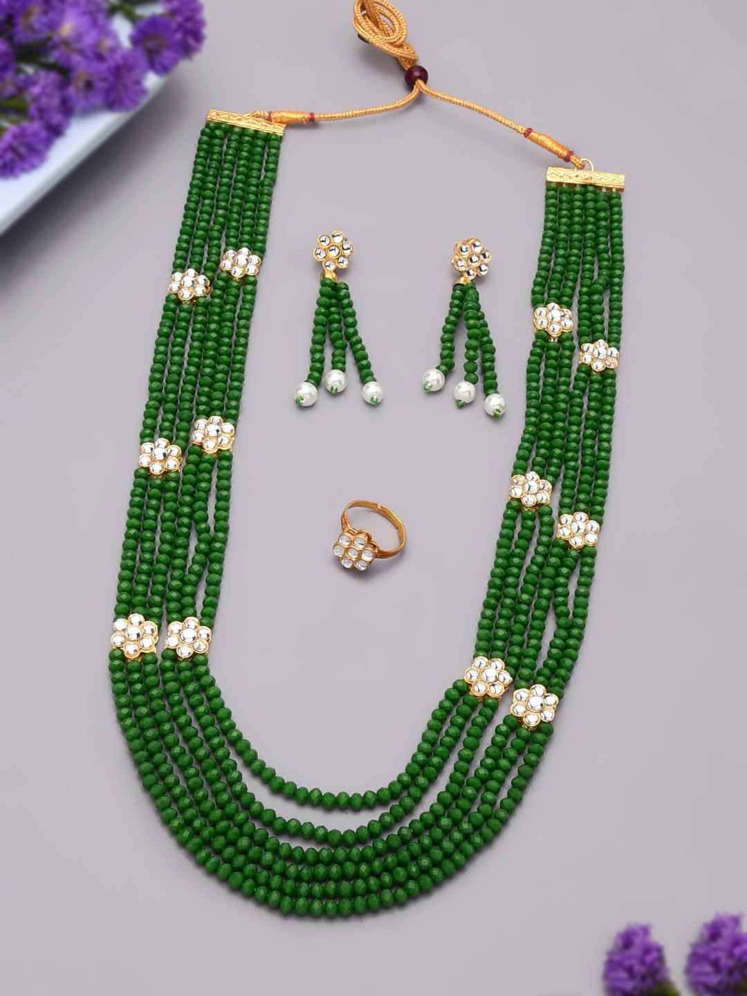 

Zaveri Pearls Gold-Plated White & Green Kundan & Pearl Studded Multistrand Jewellery Set