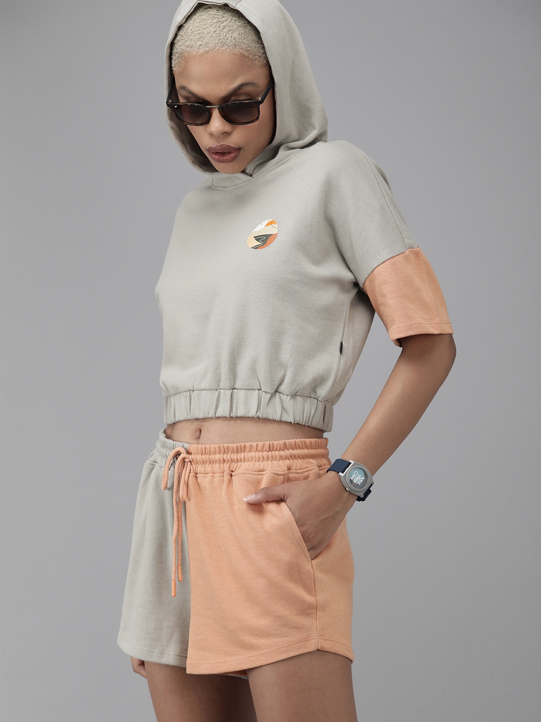 

Roadster The Lifestyle Co Women Grey & Peach Orange Colourblocked Crop Tshirt & Shorts Set