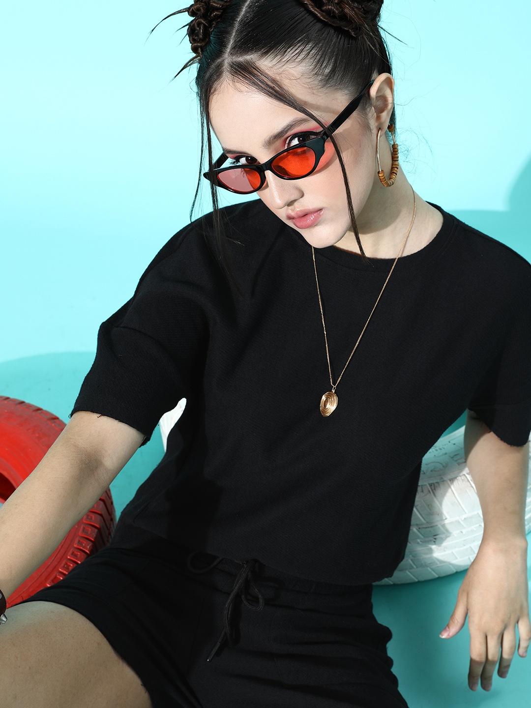 

Roadster Women Classy Black Solid T-Shirt with Shorts