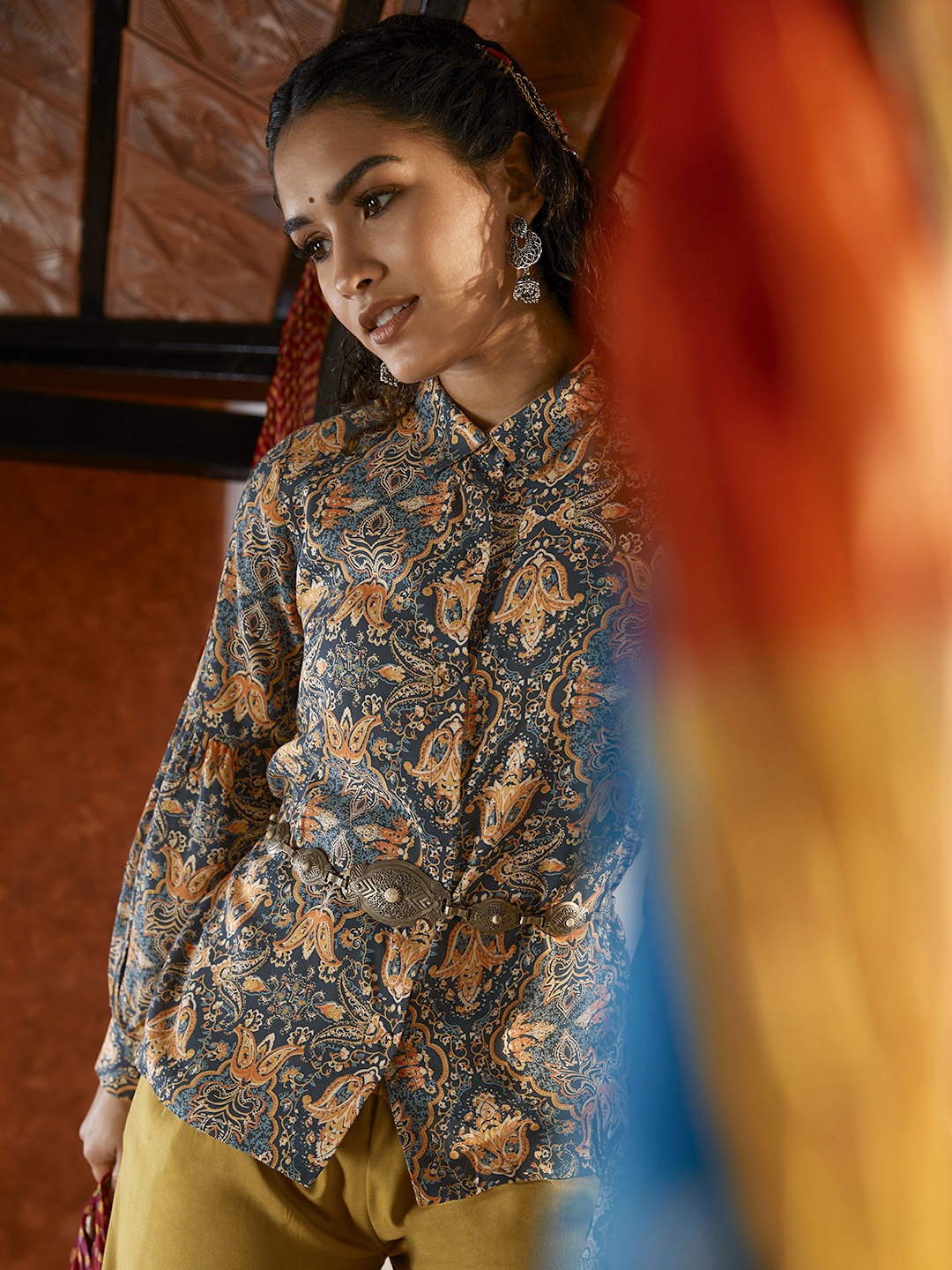 

Sangria Women Navy Blue & Orange Ethnic Motifs Printed Shirt Style Top