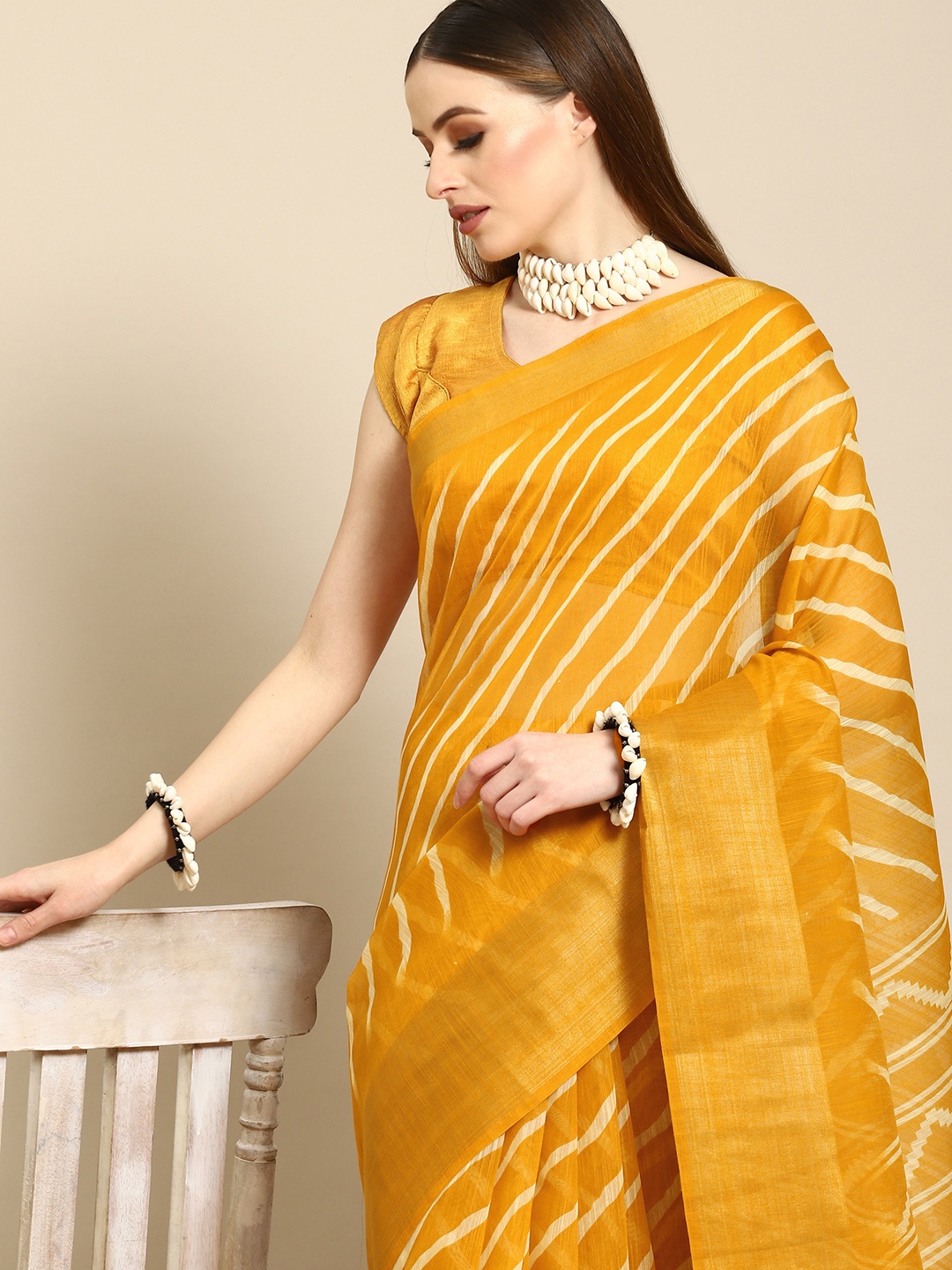 

Anouk Mustard & Cream-Coloured Leheriya Cotton Blend Saree