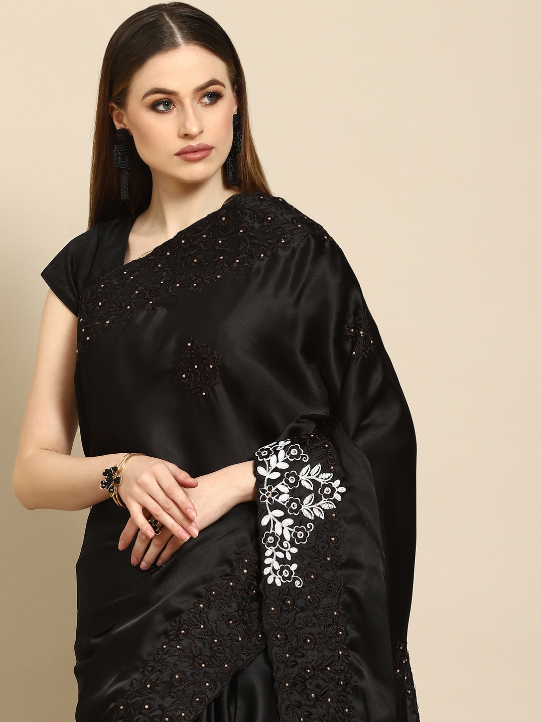 

Anouk Black Ethnic Motifs Beads and Stones Satin Saree