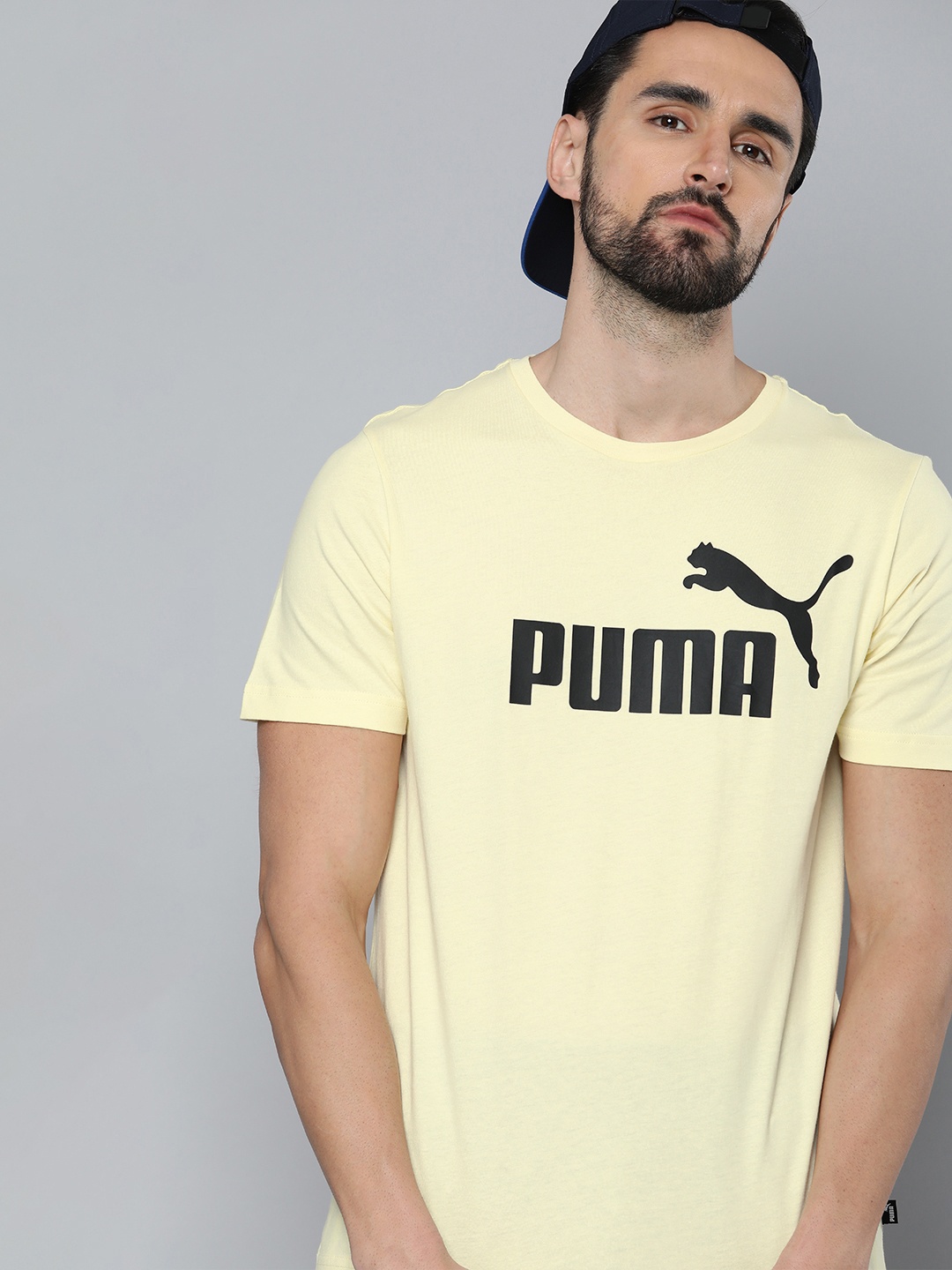

Puma Men Yellow & Black Essentials Brand Logo Printed Pure Cotton T-shirt