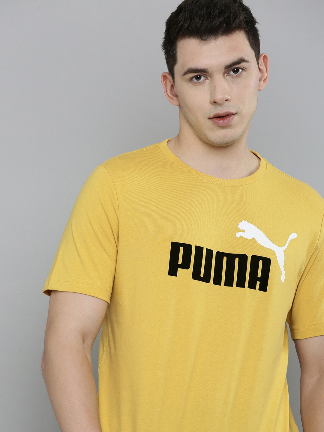 

Puma Men Yellow & Black Brand Logo Printed Pure Cotton T-shirt