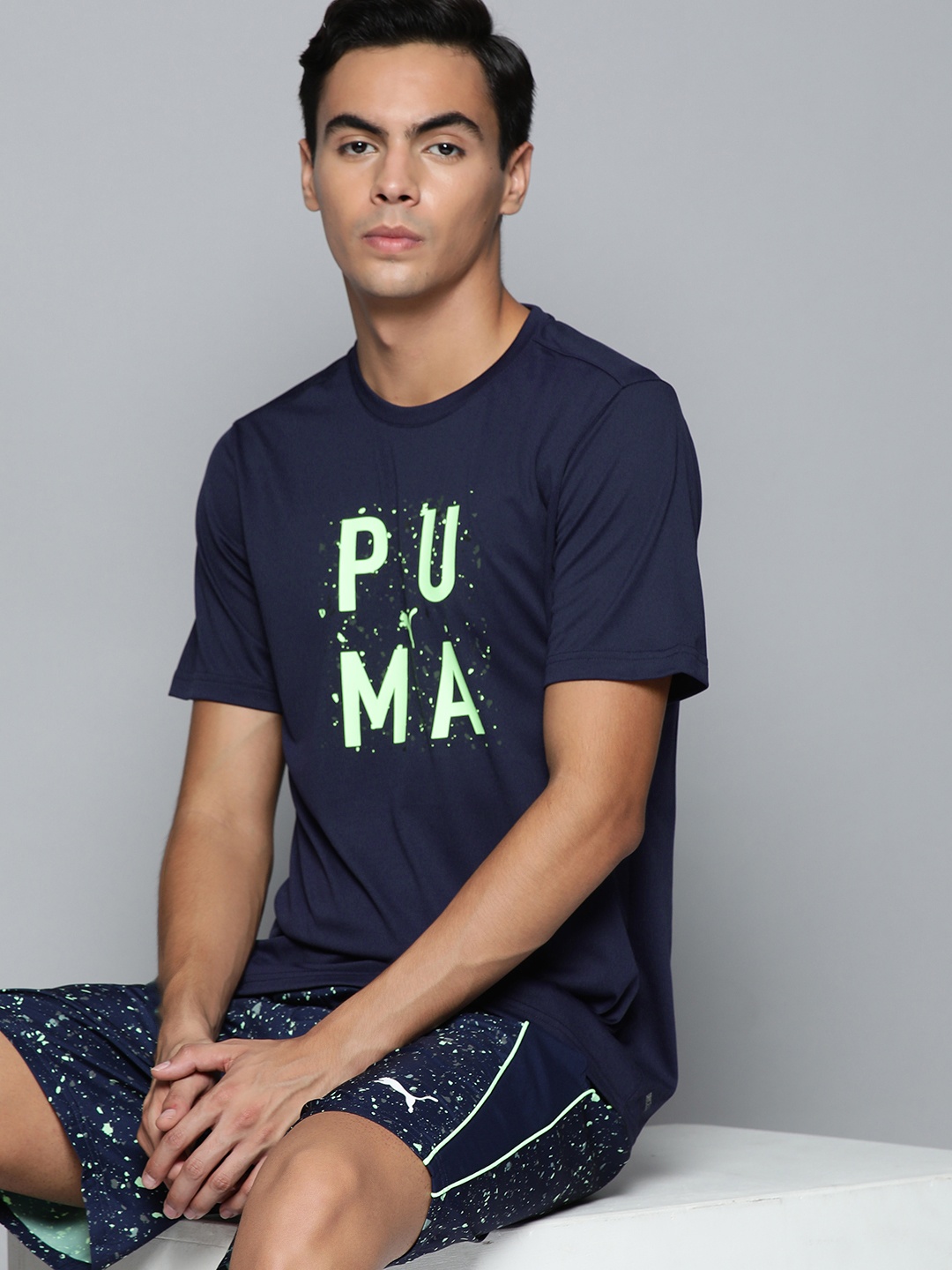 

Puma Men Blue & Lime Green Printed Training or Gym T-shirt