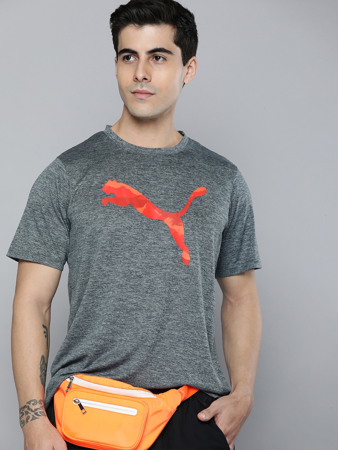 

Puma Men Grey & Orange Brand Logo Printed Training or Gym Sustainable T-shirt