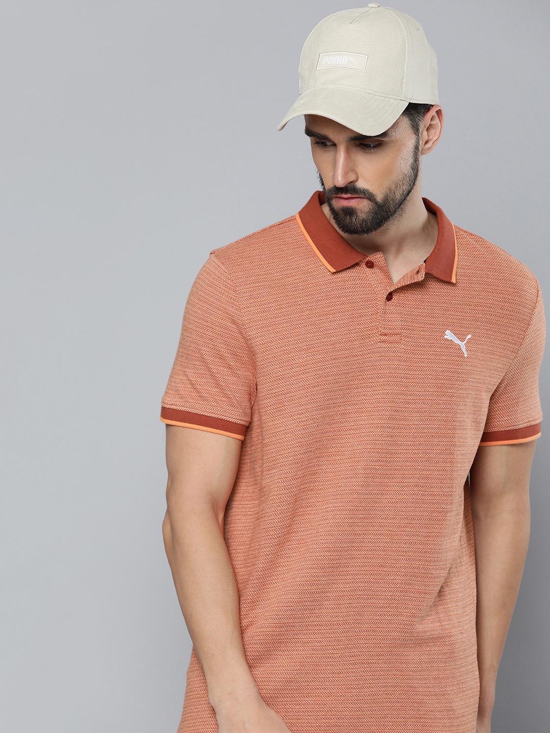

Puma Men Rust Red Self-Design Slim Fit Pure Cotton Polo Collar T-shirt