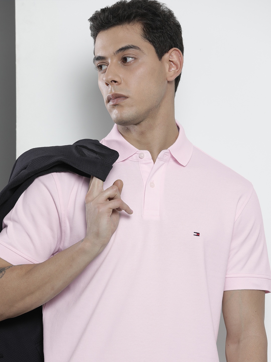 

Tommy Hilfiger Men Light Pink Solid Polo Collar Casual T-shirt
